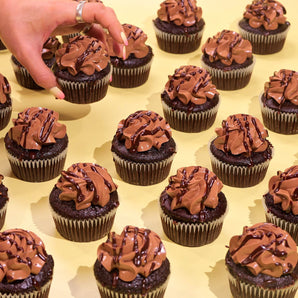 Vegan Chocolate Cupcakes with rich chocolate sponge, plant-based buttercream, and chocolate drizzle from Crumbs & Doilies.